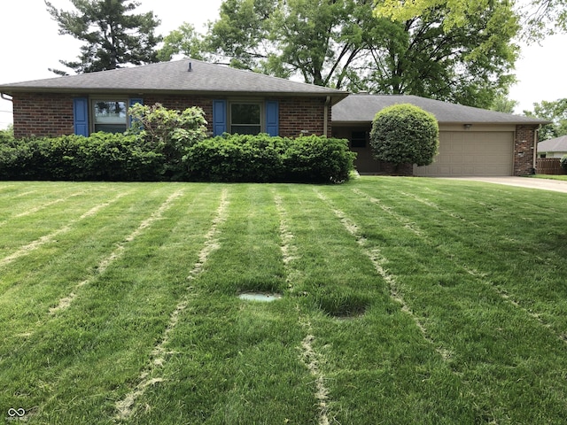 3619 31st St, Columbus, IN 47203 - ranch-style house featuring brick siding, driveway, and a garage