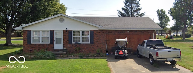 view of front facade featuring brick siding, driveway, an attached garage, and a front yard