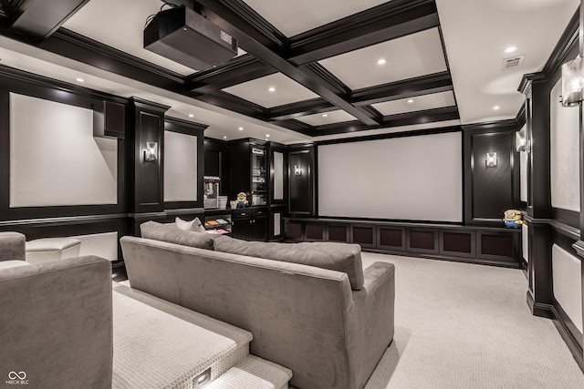 cinema with a decorative wall, ornamental molding, beam ceiling, light colored carpet, and coffered ceiling