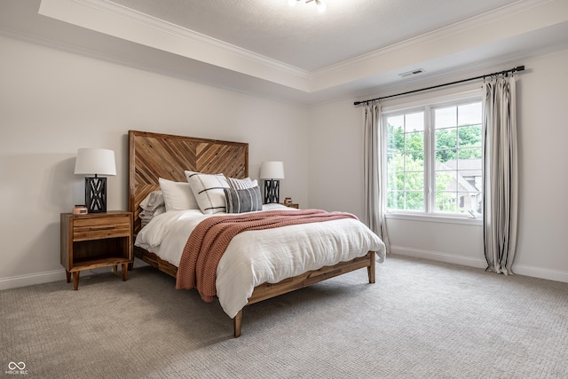 bedroom with ornamental molding, light carpet, a raised ceiling, and baseboards