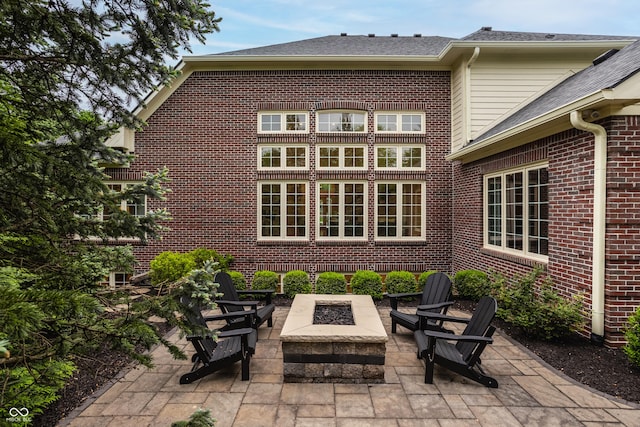 view of patio / terrace with a fire pit