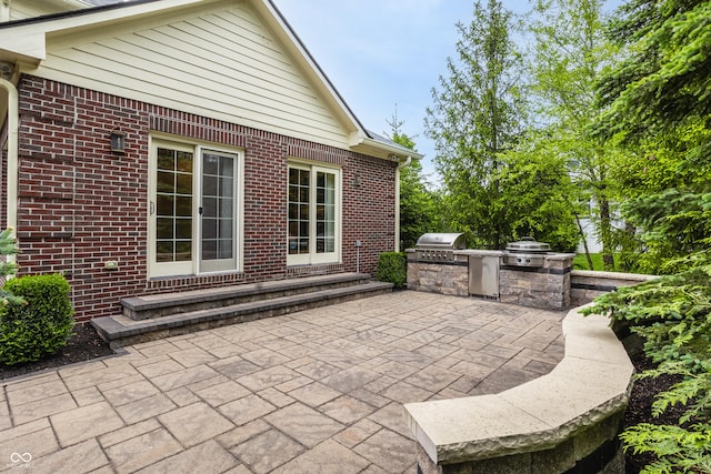 view of patio / terrace with area for grilling and a grill