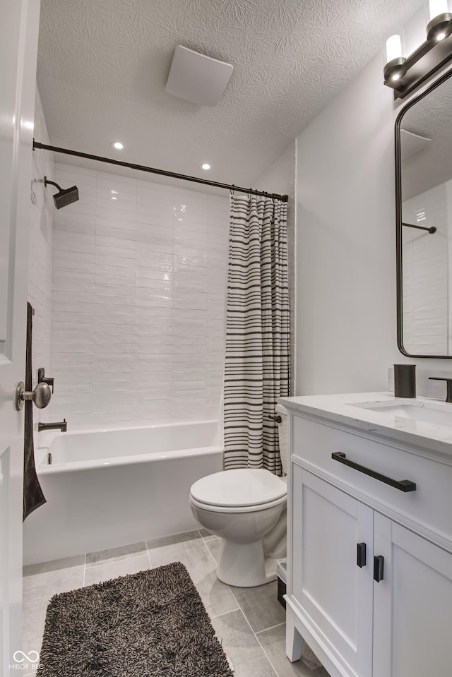 bathroom featuring toilet, vanity, shower / bathtub combination with curtain, a textured ceiling, and tile patterned floors