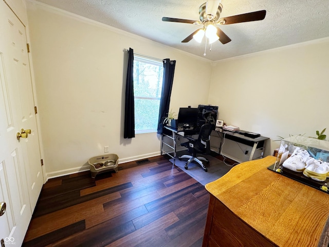 home office featuring dark wood-type flooring, ceiling fan, a textured ceiling, baseboards, and crown molding