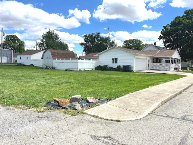 1216 N Cherry St, Rushville, IN 46173 - view of yard with a garage and driveway