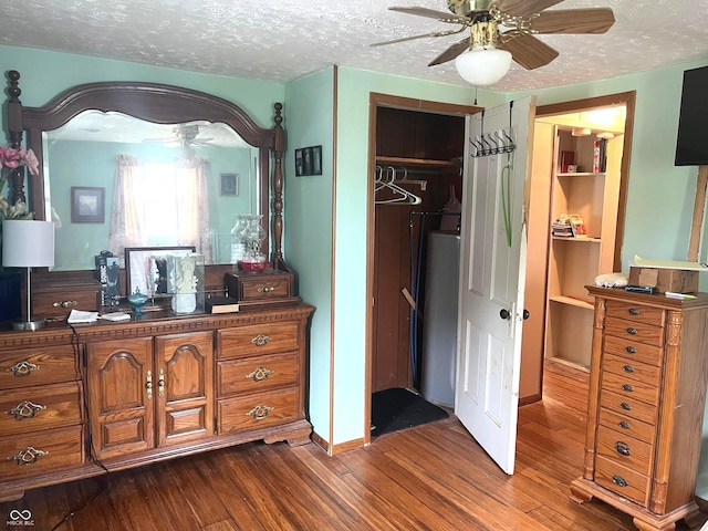 1216 N Cherry St, Rushville, IN 46173 - bedroom with a textured ceiling, dark wood-style floors, a closet, baseboards, and ceiling fan