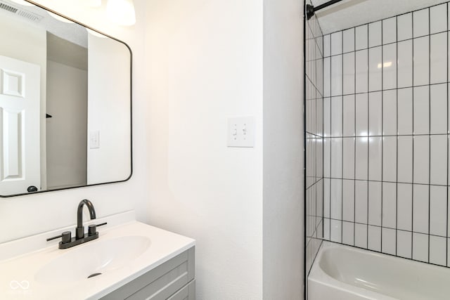 full bath featuring vanity and shower / bathtub combination