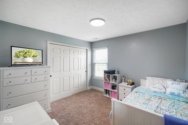204 Oakview Dr, Mooresville, IN 46158 - carpeted bedroom with a closet, baseboards, and a textured ceiling