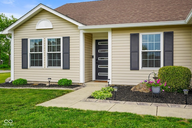 204 Oakview Dr, Mooresville, IN 46158 - property entrance with a shingled roof and a yard