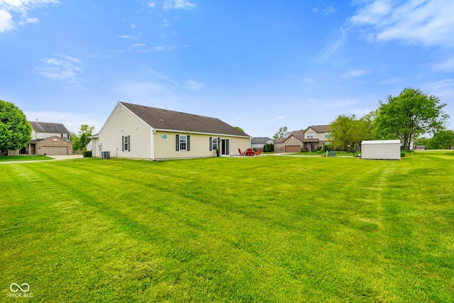 204 Oakview Dr, Mooresville, IN 46158 - rear view of house featuring an outbuilding, a yard, and a storage shed