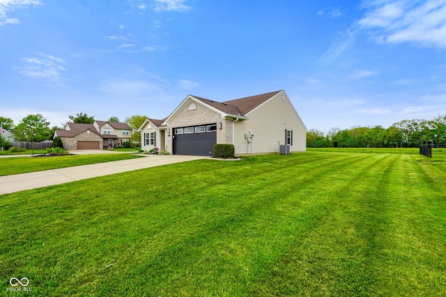 204 Oakview Dr, Mooresville, IN 46158 - view of front facade featuring driveway, a front yard, a garage, and central air condition unit
