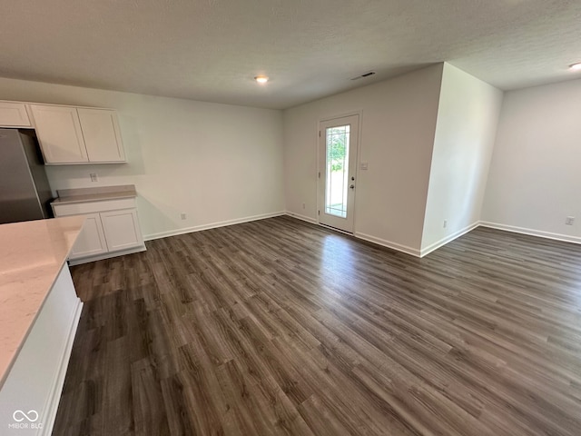 6712 Rawlings Ln, Indianapolis, IN 46221 - unfurnished living room with dark wood-style flooring and recessed lighting
