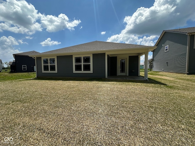 6712 Rawlings Ln, Indianapolis, IN 46221 - back of property featuring a patio area and a lawn