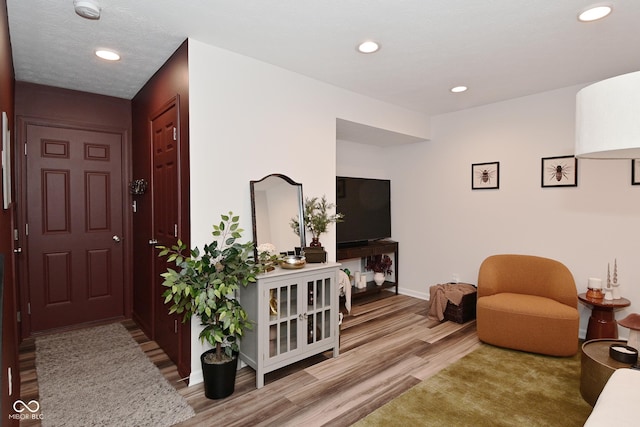 3110 W New York St, Indianapolis, IN 46222 - entryway with wood finished floors, recessed lighting, and baseboards