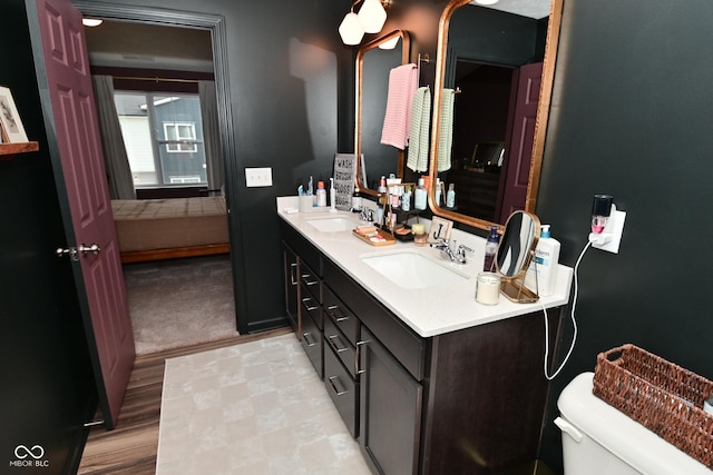 3110 W New York St, Indianapolis, IN 46222 - bathroom featuring toilet and double vanity