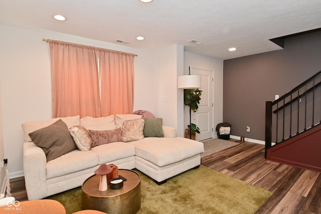 3110 W New York St, Indianapolis, IN 46222 - living area featuring stairway, wood finished floors, baseboards, and recessed lighting