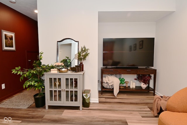 3110 W New York St, Indianapolis, IN 46222 - living room featuring wood finished floors, recessed lighting, and baseboards