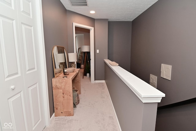 3110 W New York St, Indianapolis, IN 46222 - corridor featuring carpet, an upstairs landing, baseboards, and a textured ceiling