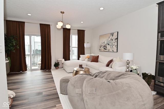 3110 W New York St, Indianapolis, IN 46222 - living room featuring plenty of natural light, wood finished floors, and recessed lighting