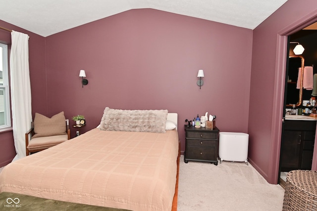 3110 W New York St, Indianapolis, IN 46222 - bedroom featuring vaulted ceiling, carpet flooring, a sink, and baseboards