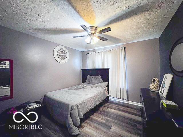 6155 W Bayfront, Mccordsville, IN 46055 - bedroom with wood finished floors and a ceiling fan