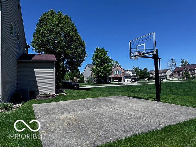 6155 W Bayfront, Mccordsville, IN 46055 - view of sport court with a lawn, basketball hoop, and a residential view