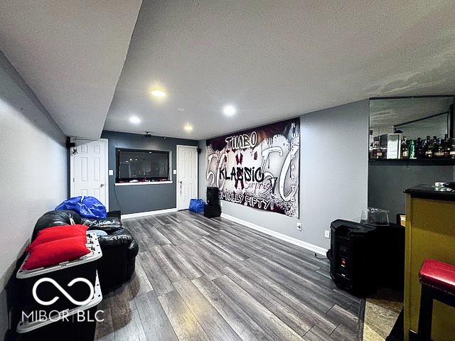 6155 W Bayfront, Mccordsville, IN 46055 - recreation room featuring wood finished floors, baseboards, recessed lighting, and a textured ceiling