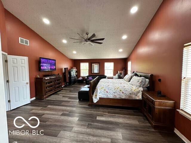 6155 W Bayfront, Mccordsville, IN 46055 - bedroom with wood finished floors, recessed lighting, multiple windows, baseboards, and a textured ceiling