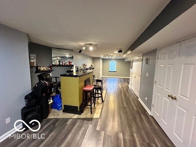 6155 W Bayfront, Mccordsville, IN 46055 - indoor dry bar with dark wood-type flooring and baseboards