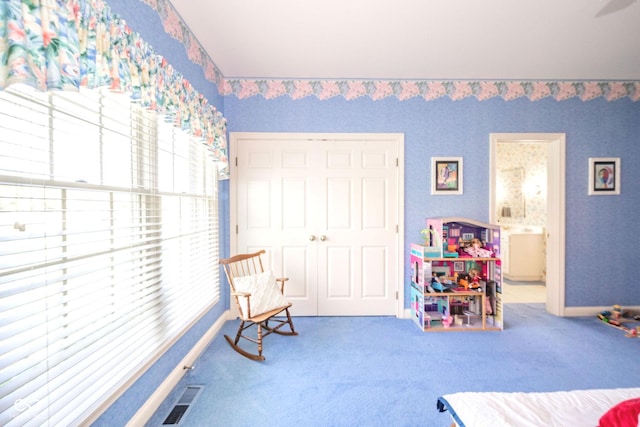 1105 Deer Creek Dr, Anderson, IN 46011 - carpeted bedroom featuring baseboards and ensuite bathroom