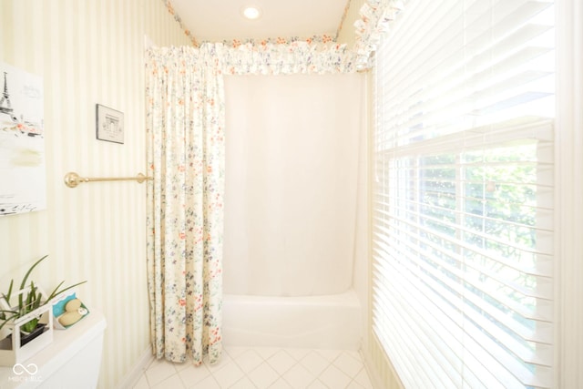 1105 Deer Creek Dr, Anderson, IN 46011 - bathroom featuring toilet, shower / bath combo, tile patterned flooring, and wallpapered walls