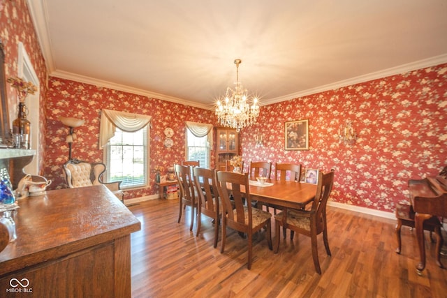 1105 Deer Creek Dr, Anderson, IN 46011 - dining room with wood finished floors, baseboards, a chandelier, wallpapered walls, and crown molding