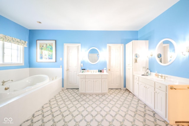 1105 Deer Creek Dr, Anderson, IN 46011 - bathroom featuring a garden tub and two vanities