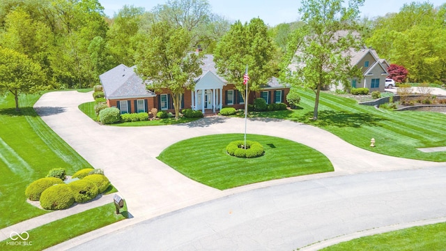 1105 Deer Creek Dr, Anderson, IN 46011 - view of front facade featuring curved driveway and a front yard