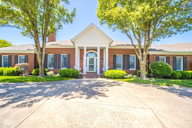 1105 Deer Creek Dr, Anderson, IN 46011 - greek revival inspired property with brick siding and a chimney