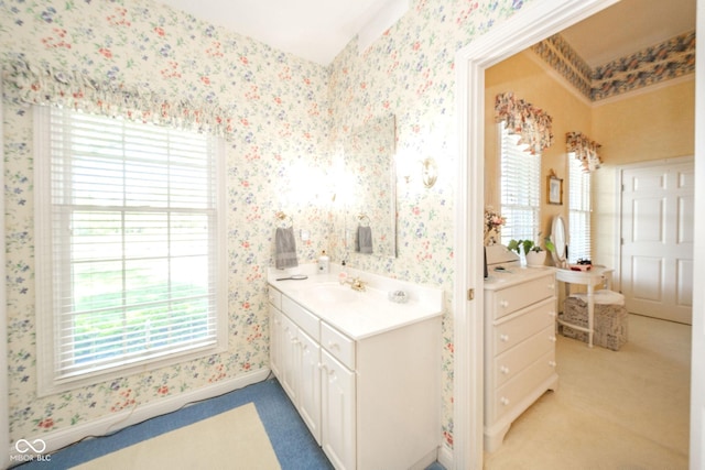 1105 Deer Creek Dr, Anderson, IN 46011 - bathroom featuring vanity, wallpapered walls, plenty of natural light, and baseboards