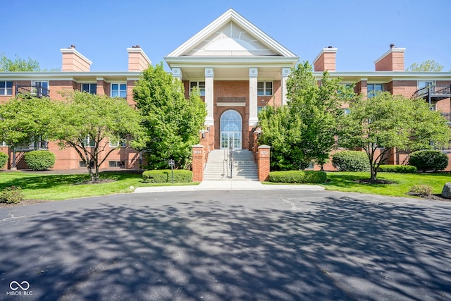 8751 Jaffa Court E Dr Apt 32, Indianapolis, IN 46260 - view of front of house featuring brick siding and a chimney