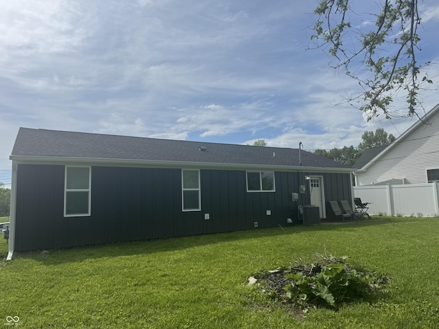 3641 S Rogers St, Bloomington, IN 47403 - rear view of house featuring central AC and board and batten siding