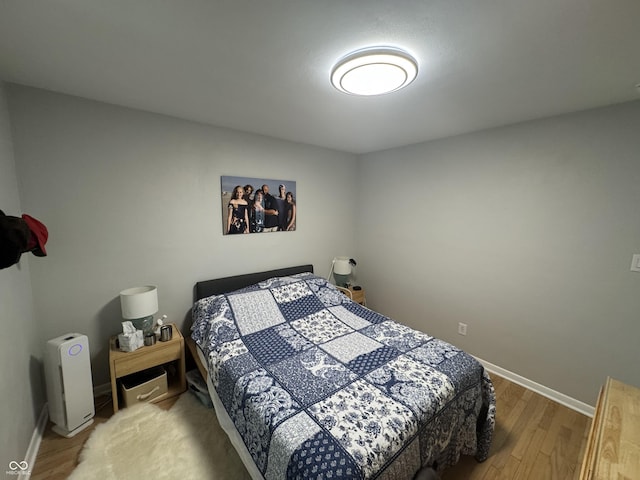3641 S Rogers St, Bloomington, IN 47403 - bedroom with wood finished floors and baseboards