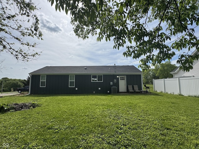 3641 S Rogers St, Bloomington, IN 47403 - rear view of house with central air condition unit and board and batten siding