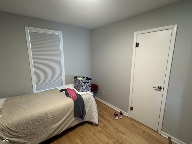3641 S Rogers St, Bloomington, IN 47403 - bedroom featuring light wood-type flooring and baseboards