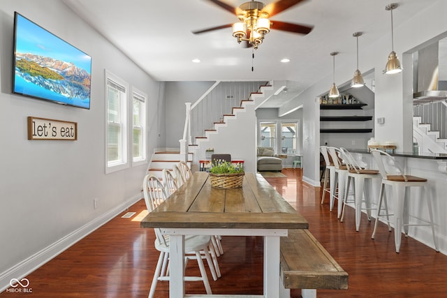 dining room featuring stairs, a ceiling fan, wood finished floors, recessed lighting, and baseboards