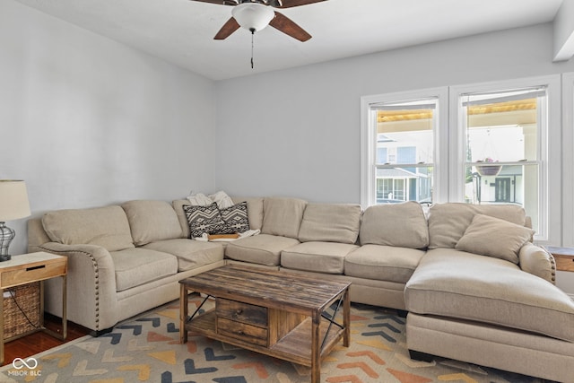 living area with ceiling fan and wood finished floors