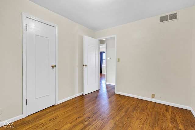 518 N Carr Rd, Plainfield, IN 46168 - unfurnished bedroom with wood finished floors and baseboards