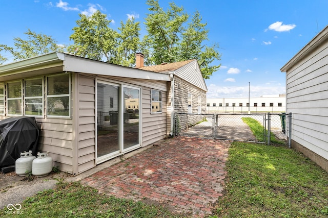 518 N Carr Rd, Plainfield, IN 46168 - view of property exterior with a gate, fence, and a chimney