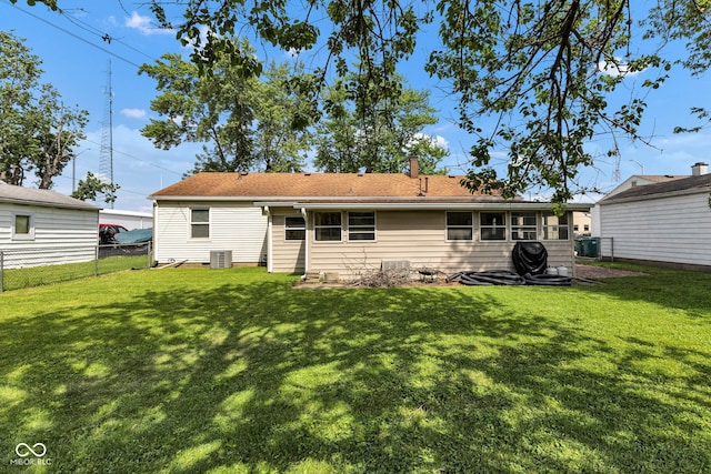 518 N Carr Rd, Plainfield, IN 46168 - rear view of house with central AC unit and a chimney