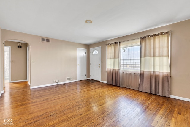 518 N Carr Rd, Plainfield, IN 46168 - foyer with arched walkways, wood finished floors, and baseboards