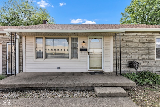 518 N Carr Rd, Plainfield, IN 46168 - view of exterior entry featuring a shingled roof