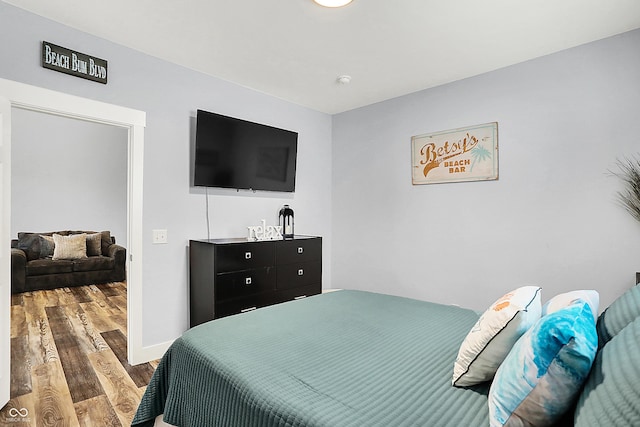 bedroom with wood finished floors