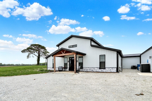 view of front of house featuring central air condition unit and board and batten siding